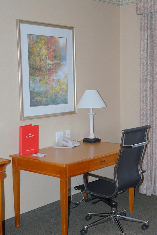 Ramada By Wyndham Olympia Hotel Room photo A typical hotel room desk